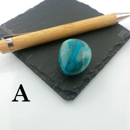 Chrysocolla with Malachite Tumble Stone on a dark slate coaster