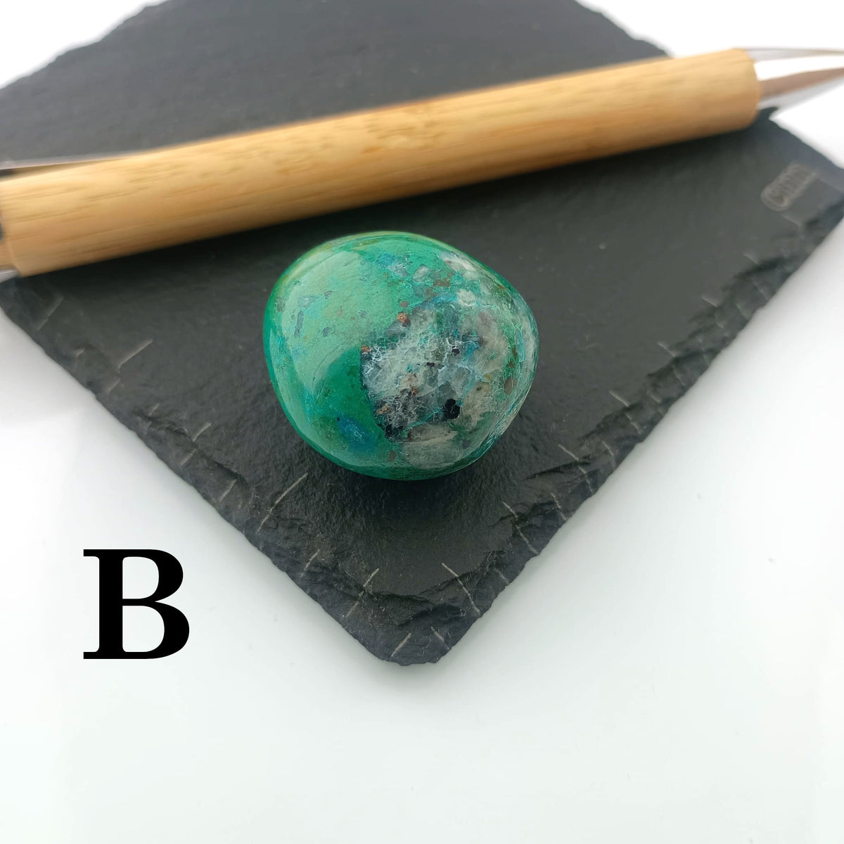 Chrysocolla with Malachite Tumble Stone on a dark slate coaster