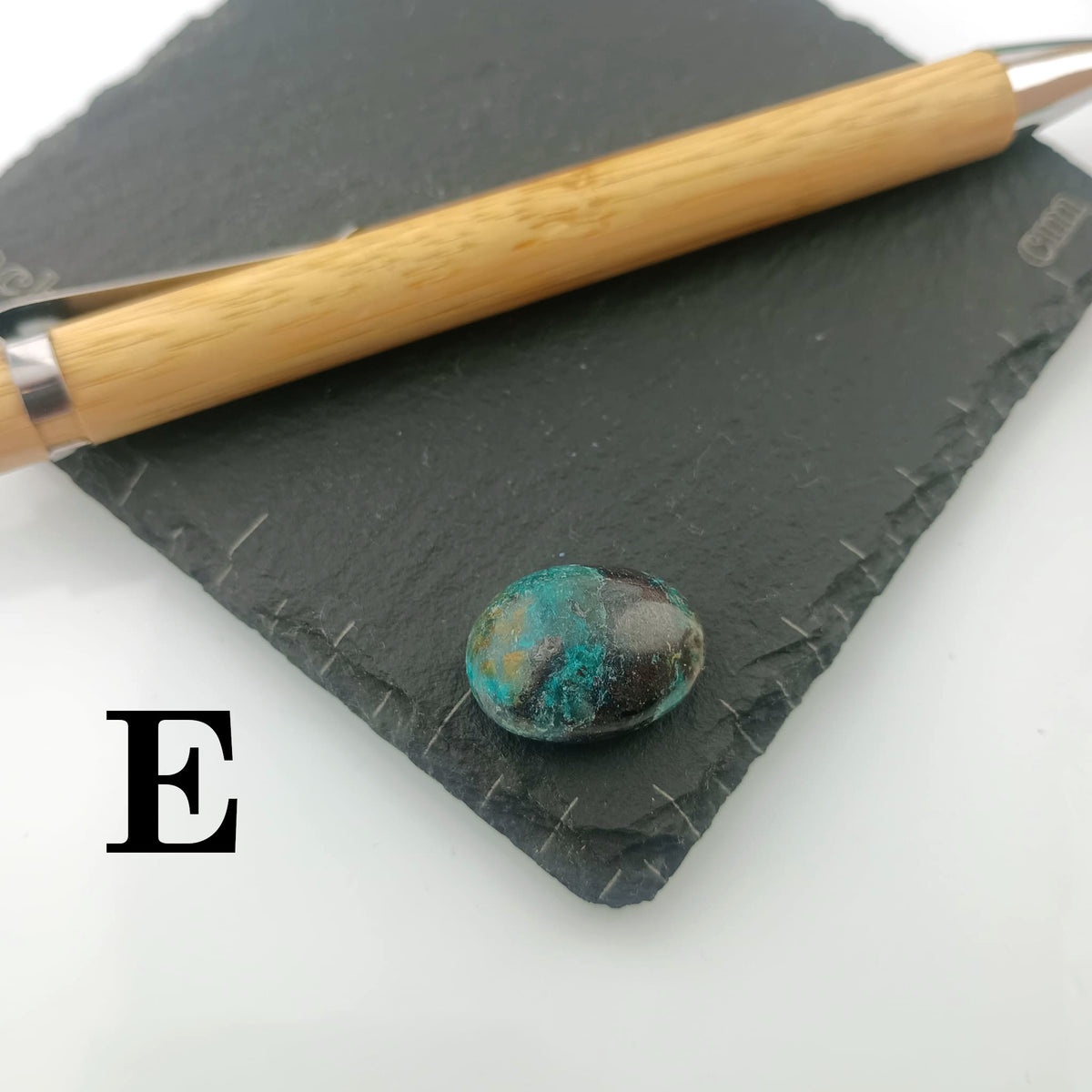 Chrysocolla with Malachite Tumble Stone on a dark slate coaster