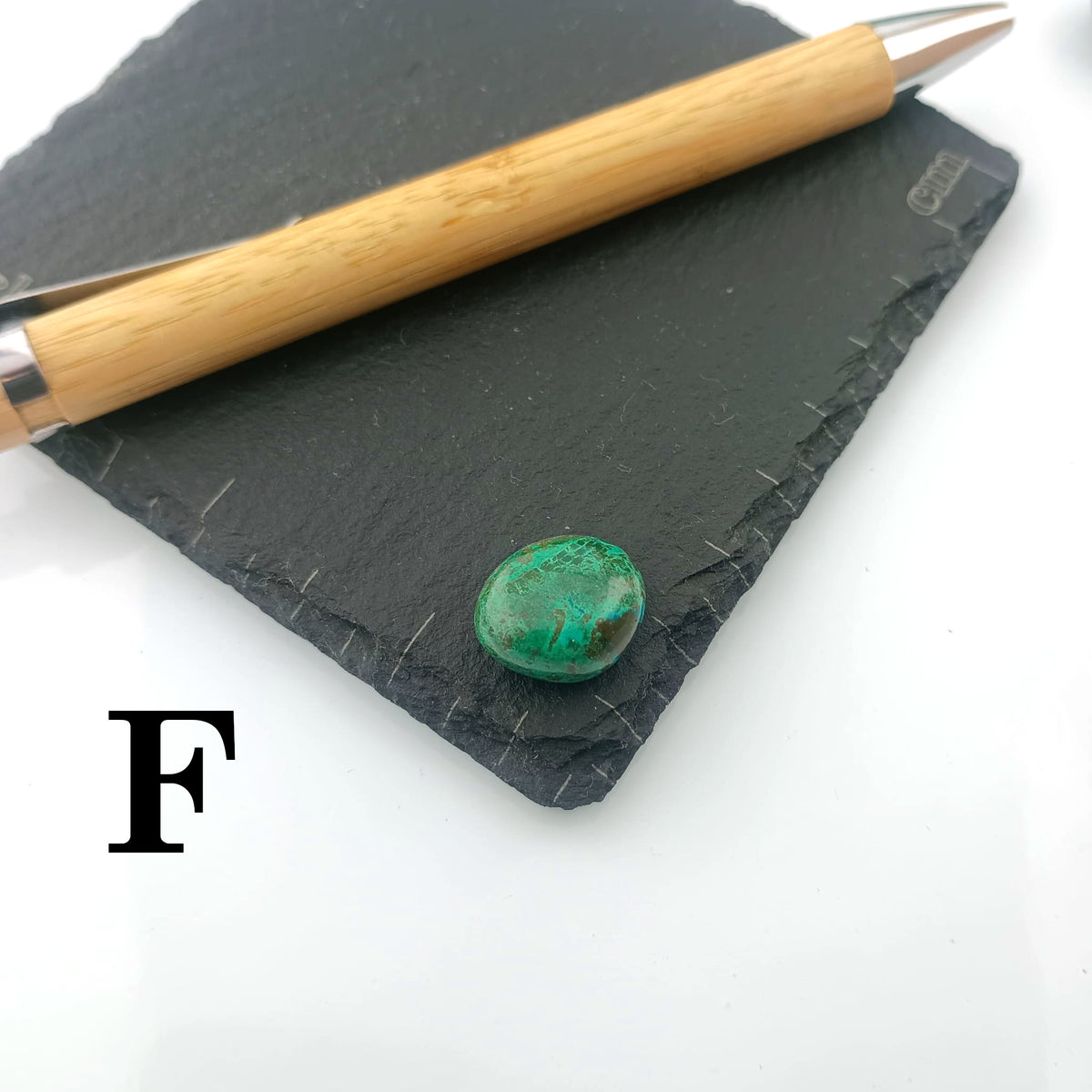 Chrysocolla with Malachite Tumble Stone on a dark slate coaster