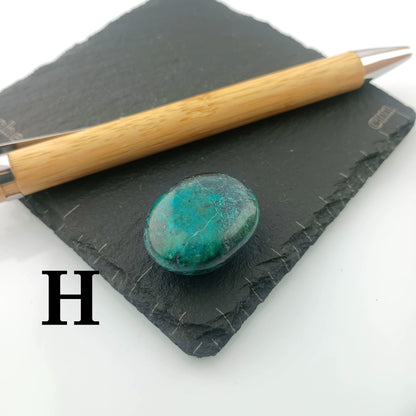 Chrysocolla with Malachite Tumble Stone on a dark slate coaster
